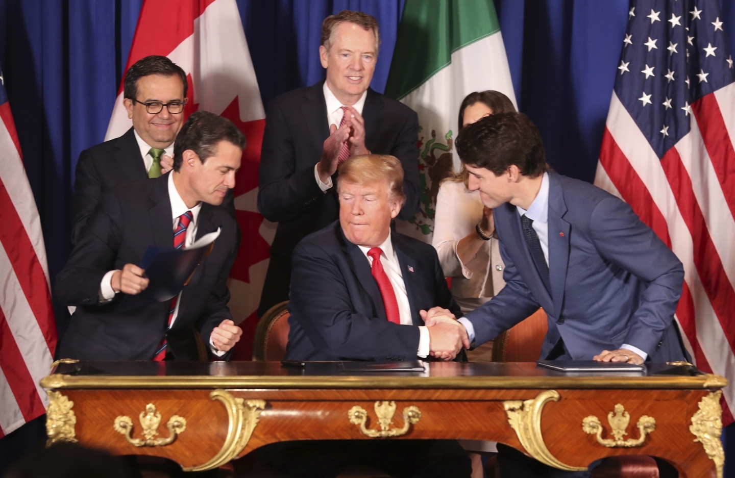 Leaders shake hands after signing the Canada-United States-Mexico Agreement on Friday, Nov. 30, 2018. (AP Photo/Martin Mejia)