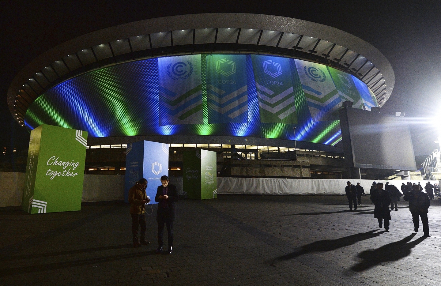 Participants in the United Nations climate talks leave the venue at the end of the day's session in Katowice, Poland, on December 12, 2018. (AP Photo/Czarek Sokolowski)