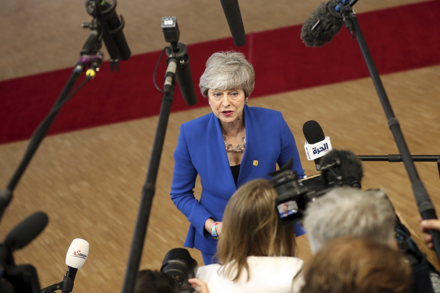 British Prime Minister Theresa May speaks with the media as she arrives for an EU summit at the Europa building in Brussels on April 10, 2019. (AP Photo/Francisco Seco)