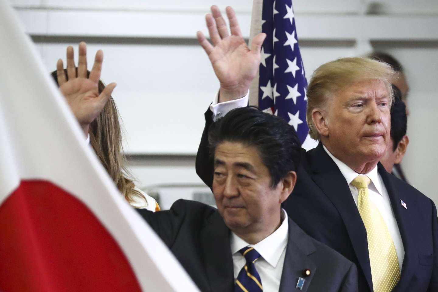 US President Donald Trump and Japan's Prime Minister Shinzo Abe wave after delivering a speech to Japanese and US troops on May 28, 2019. (Athit Perawongmetha/Pool Photo vi AP)