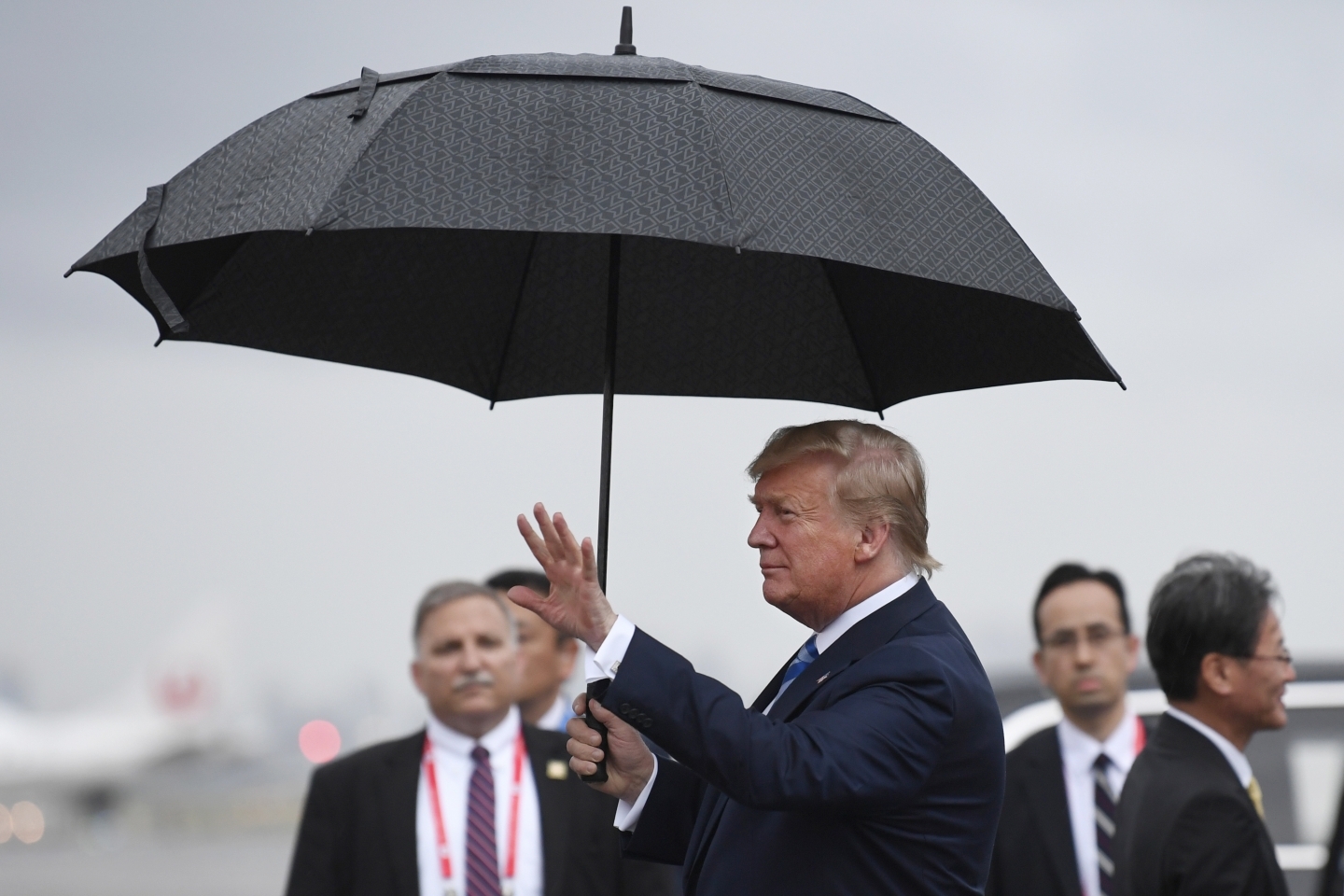 President Donald Trump waves after arriving at Osaka International Airport on June 27, 2019. (AP Photo/Susan Walsh)