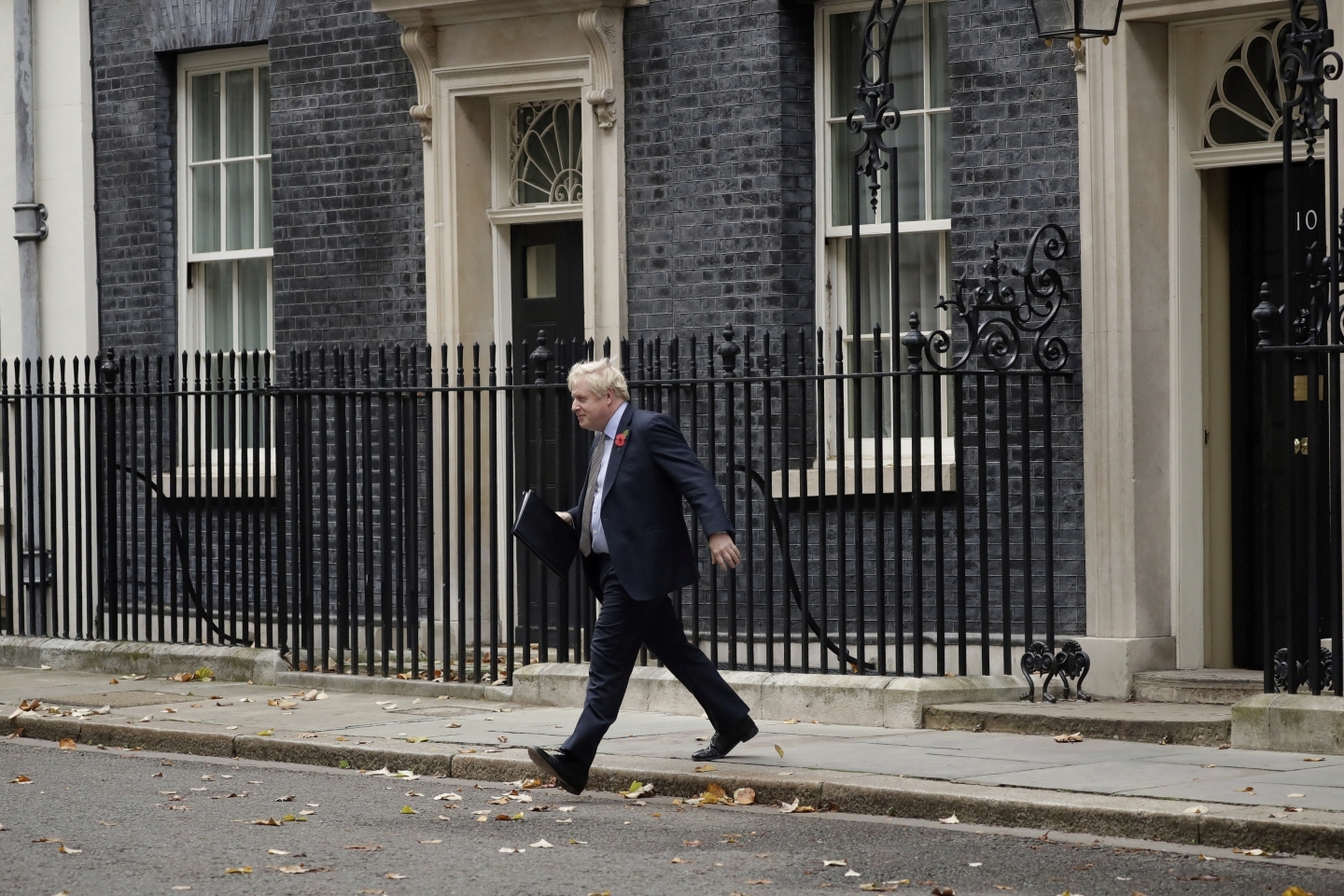 Britain's Prime Minister Boris Johnson walks from the front door of 10 Downing Street, London, on November 6, 2019 ahead of the formal start of the general election. (AP Photo/Matt Dunham)