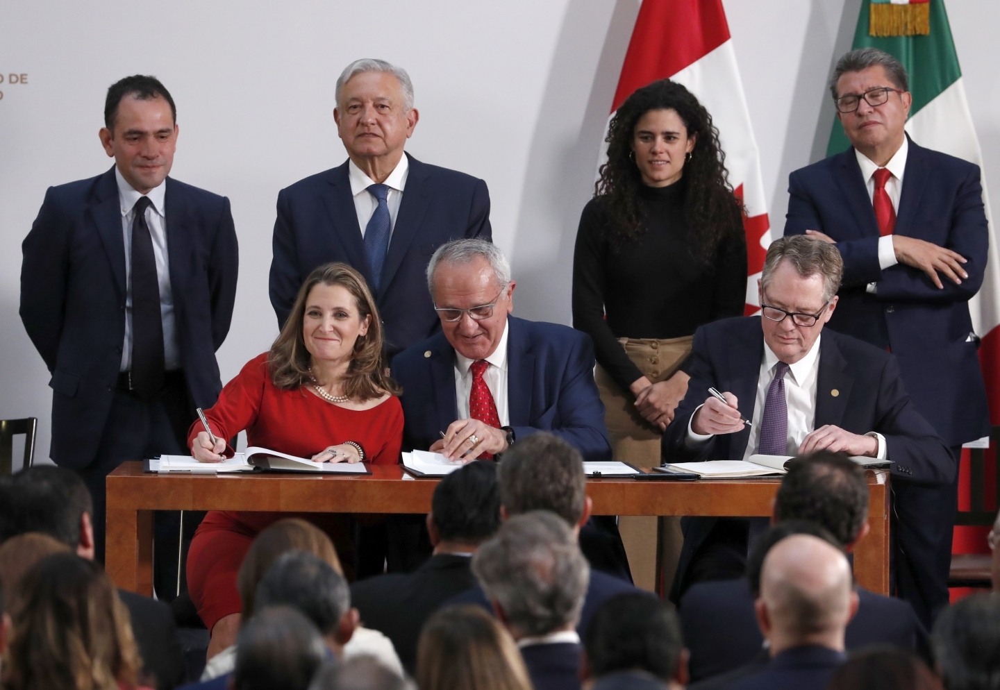 Deputy Prime Minister of Canada Chrystia Freeland, Mexico's top trade negotiator Jesus Seade and US Trade Representative Robert Lighthizer sign an update to the North American Free Trade Agreement, at the national palace in Mexico City, on December 10, 2019. (AP Photo/Marco Ugarte)