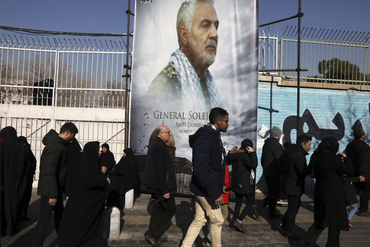 Mourners walk back from a funeral ceremony for Iranian Gen. Qassem Soleimani (AP Photo/Vahid Salemi)