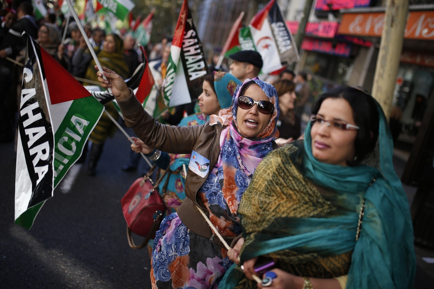 Women from Western Sahara shout slogans in support of Free Western Sahara, during a protest in Madrid (AP Photo/Andres Kudacki)