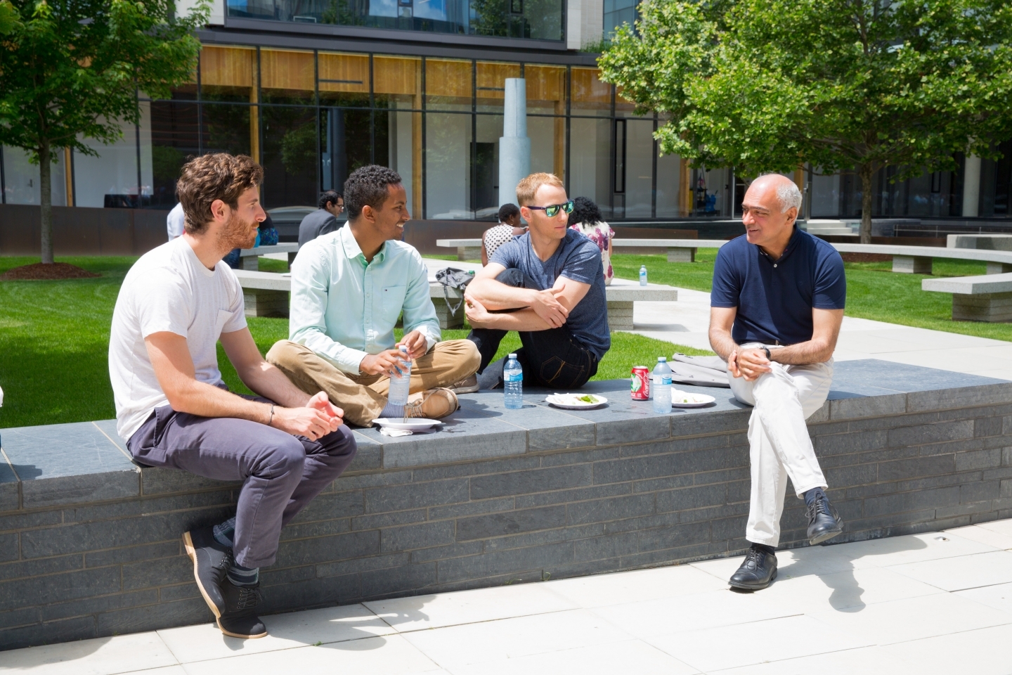 CIGI President Rohinton Medhora and staff enjoy a beautiful day in the CIGI campus courtyard over lunch.