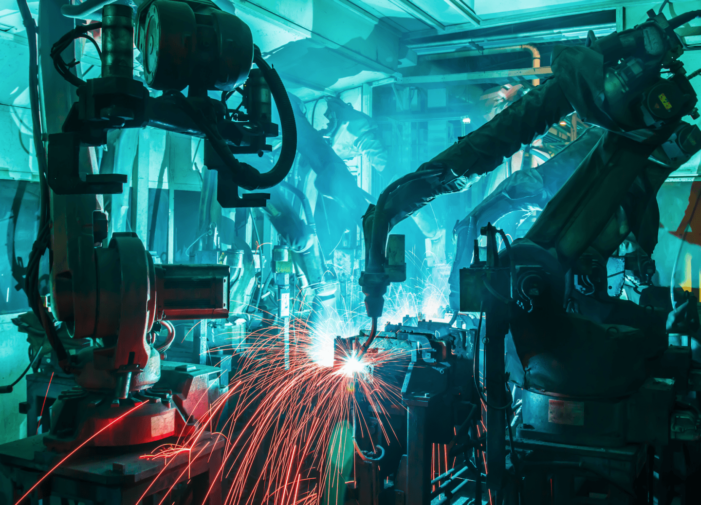Welding robots movement in a factory (Shutterstock)