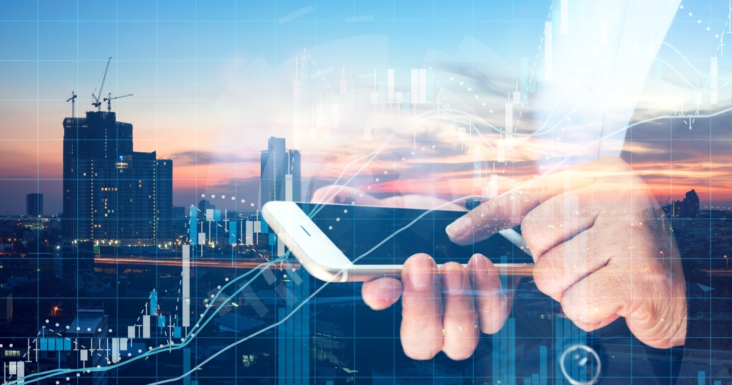 Business woman point finger to screen mobile phone and technical chart with metropolis city sunset background