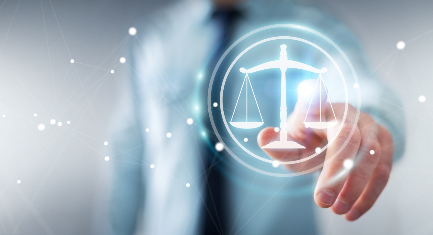 Businessman on blurred background using law protection right 3D rendering. (Shutterstock)