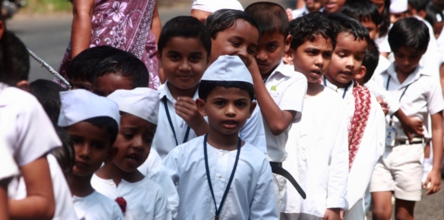 School children move in a line in Alleppey, India (AJP / Shutterstock).