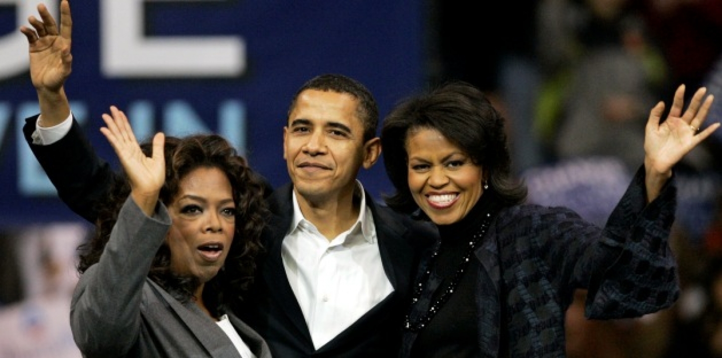 Barack Obama, his wife Michelle, right, and Oprah Winfrey wave to the crowd at a 2007 rally in Manchester, N.H. (AP Photo/Elise Amendola)