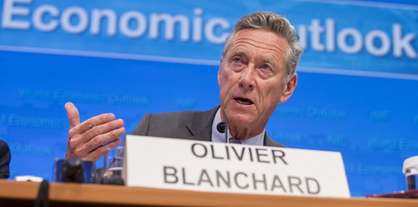 Olivier Blanchard speaks on a panel to discuss World Economic Outlook. (IMF Staff Photograph/Stephen Jaffe)