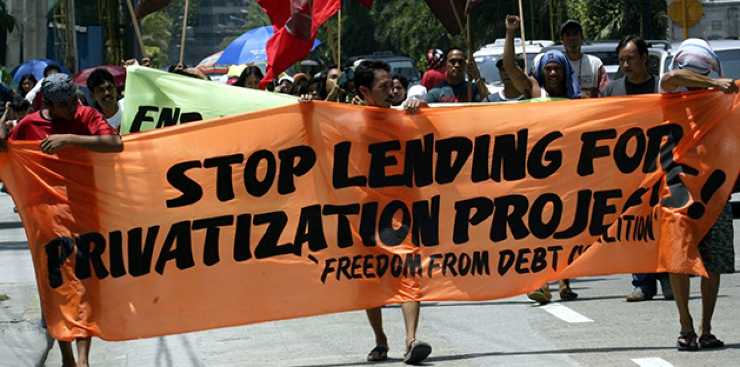 Protesters in the Philippines march towards the Asian Development Bank to demonstrate concerns over deepening poverty in the region caused by privitization programs of basic services such as power and water projects. (AP Photo/Pat Roque)