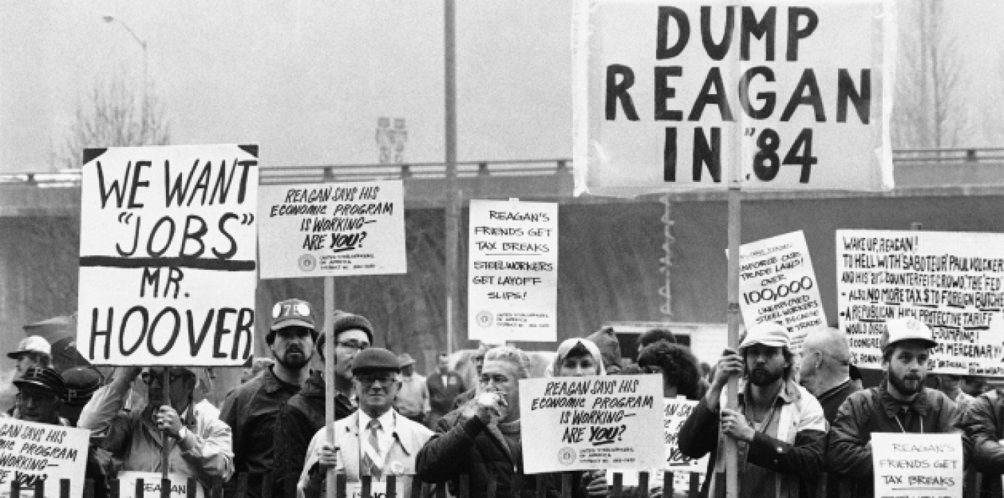 In this April 6, 1983, file photo some of an anticipated group of 10,000 unemployed, wait in the steady rain for President Ronald Reagan to arrive at his hotel. The 1981-82 recession, widely considered America's worst since the depression, is a grim marker of how bad things can get. (AP Photo/George Widman, File)
