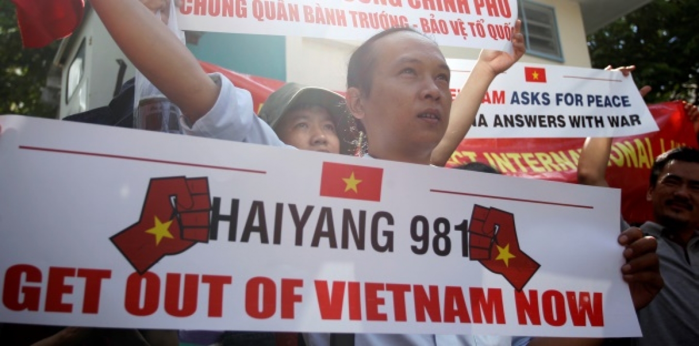 Vietnamese protesters hold banners during a protest rally against China outside the Chinese Consulate in Ho Chi Minh City, Vietnam, Saturday, May 10, 2014. (AP Photo)