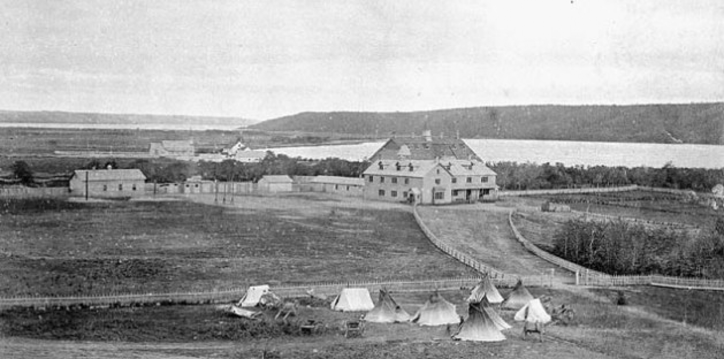 Qu'Appelle Indian Industrial School, Saskatchewan ca. 1885. Parents of Aboriginal children had to camp outside the gates of the residential schools in order to visit their children. This photograph appeared in the 1895 annual report of the Department of Indian Affairs. This image is available from Library and Archives Canada.