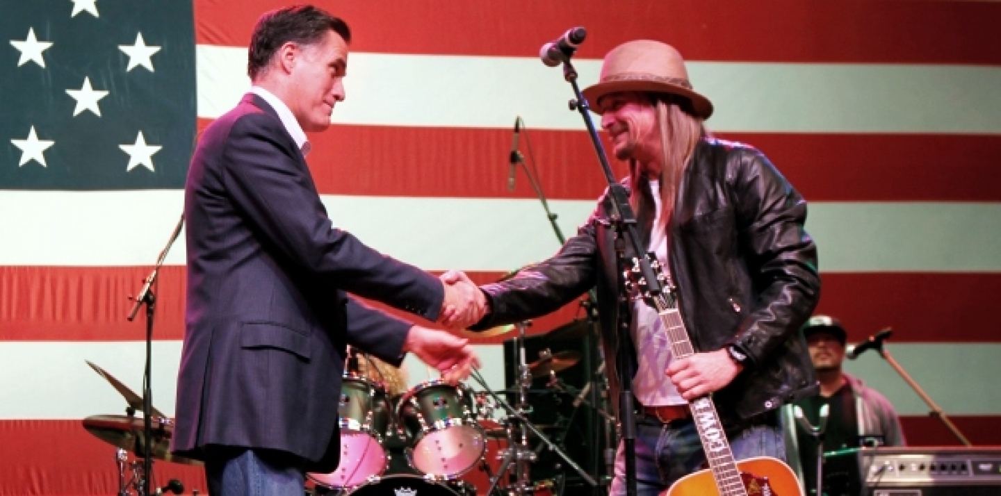 Republican presidential candidate, Mitt Romney shakes hands with musician Kid Rock at a campaign rally. (AP Photo/Gerald Herbert)