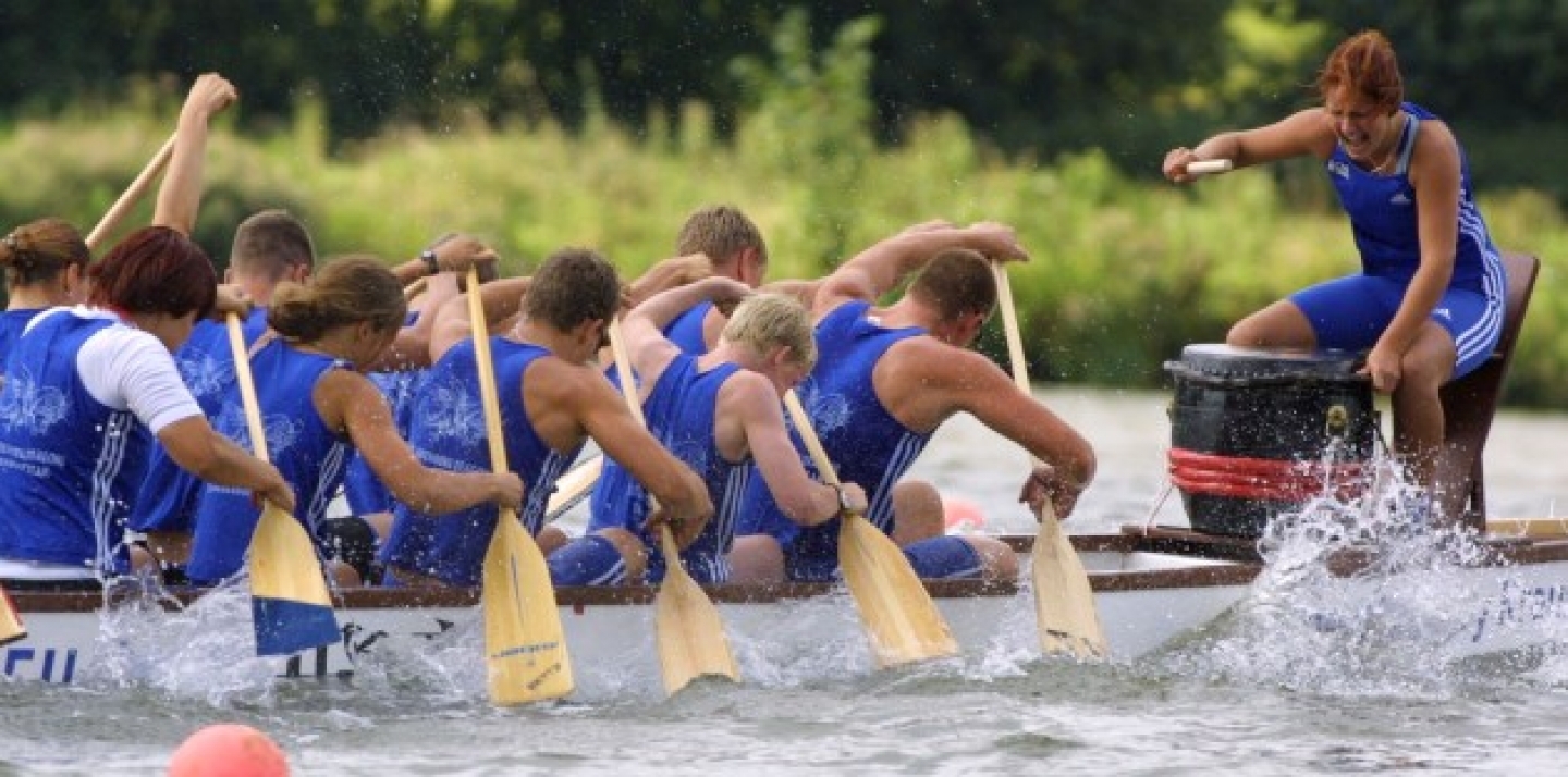 The female drummer of the Neubrandenburg dragons spurs her team during European Club Crew Championships (AP Photo/Joerg Sarbach).