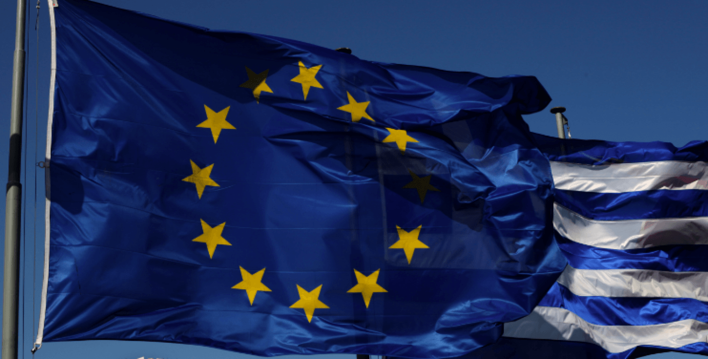An EU and a Greek flag fly in front of ancient Parthenon temple, in Athens, Sunday, June 17, 2012 as Greeks vote in the most crucial elections in decades. (AP Photo/Petros Giannakouris)