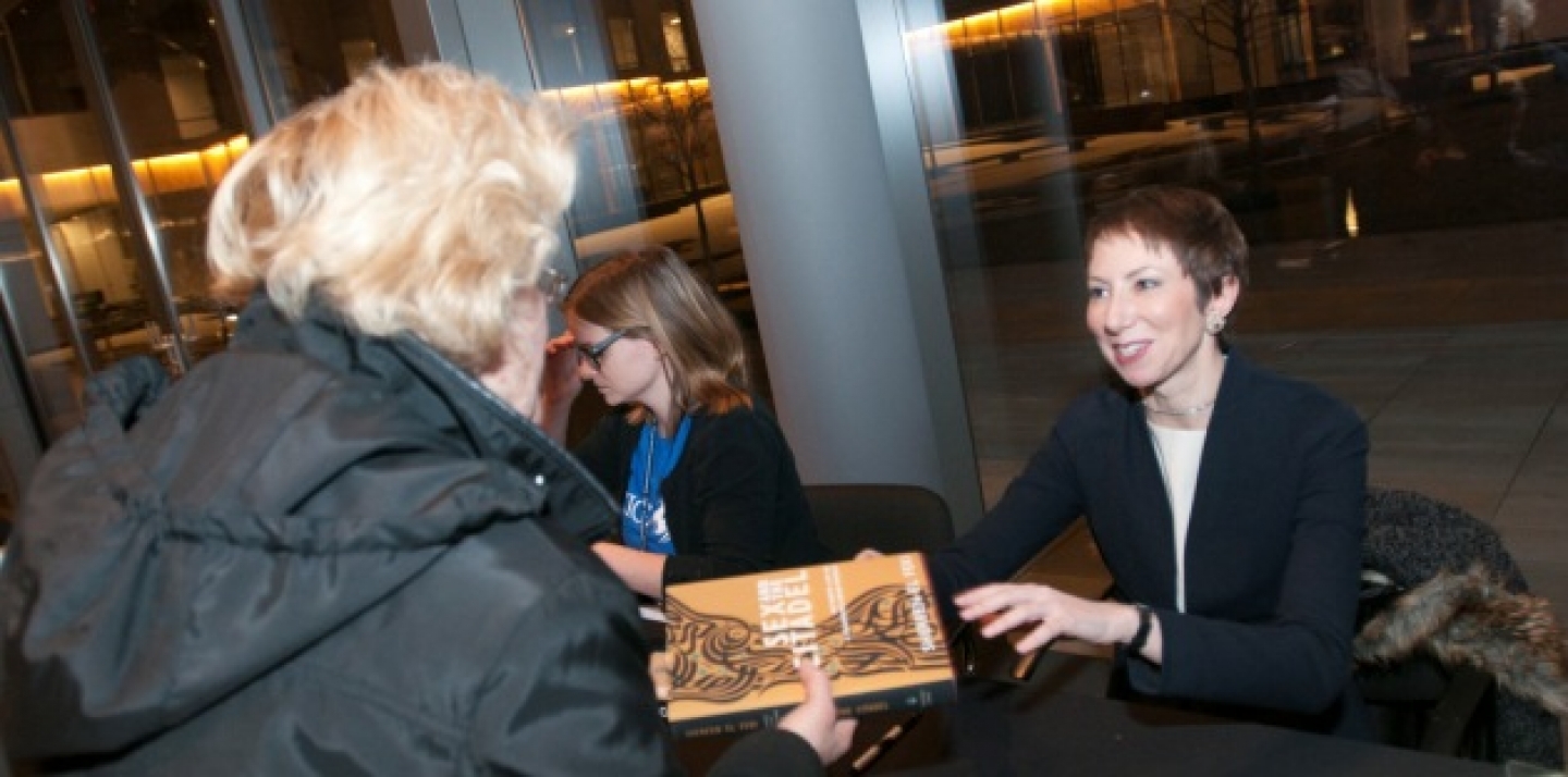 Author Shereen El Feki signs a book for an audience member, following her CIGI Signature Lecture (Lisa Malleck/CIGI).