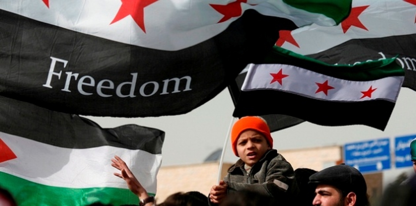 Syrians chant anti-Bashar al-Assad slogans during a protest in front of the Syrian embassy in Amman, Jordan (AP photo/Mohammad Hannon)