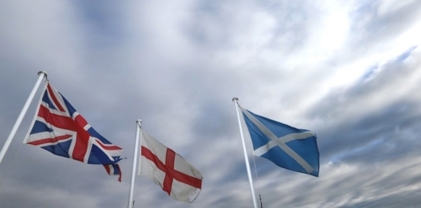 From left, the Union Jack, St George's Cross and the Saltire fly at Adderstone, England, Monday, Sept. 8, 2014.