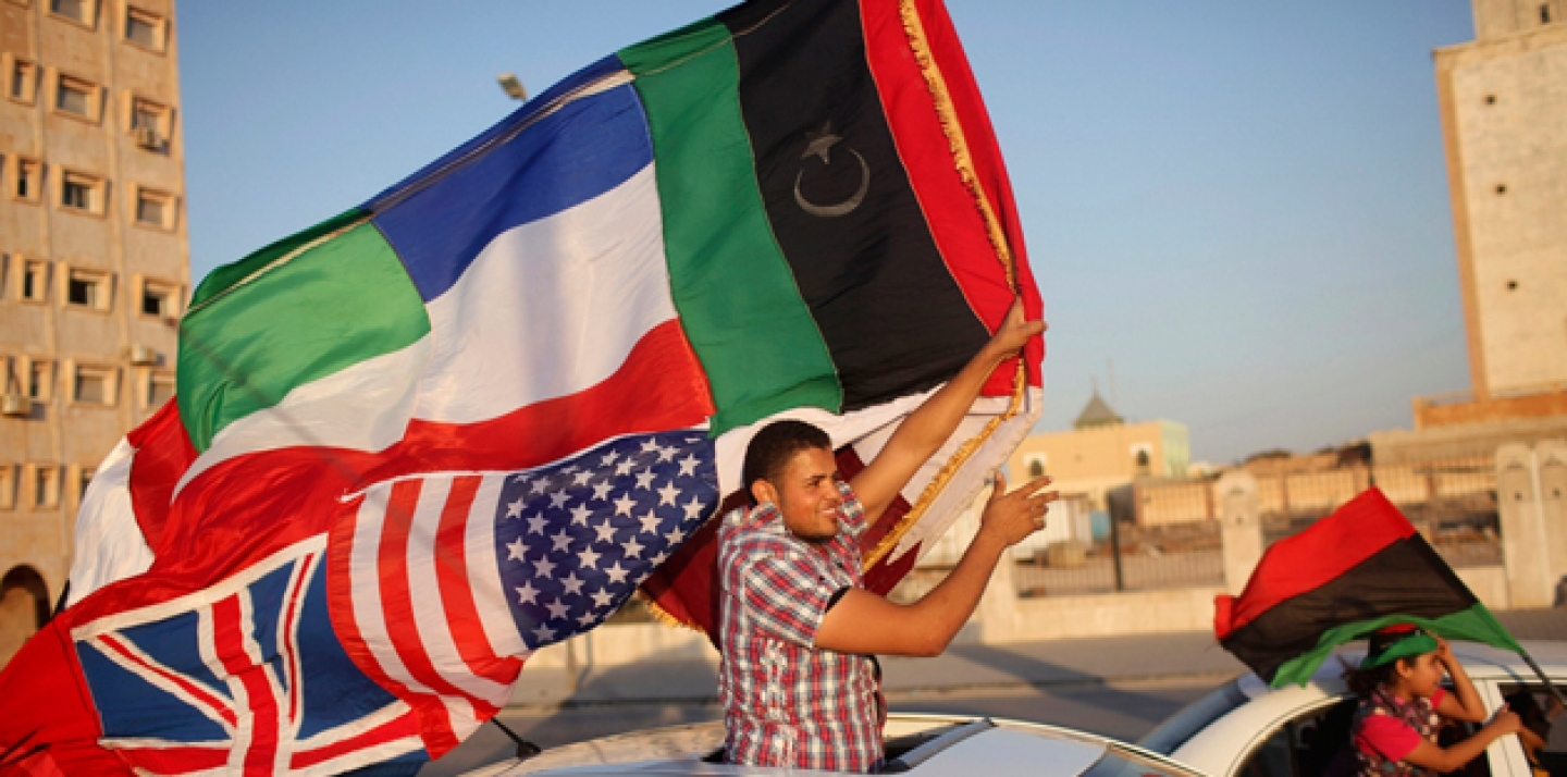 People celebrate the attack on Moammar Gadhafi's main military compound in Tripoli, in the rebel-held town of Benghazi, Libya, Tuesday, Aug. 23, 2011 (AP Photo/Alexandre Meneghini).