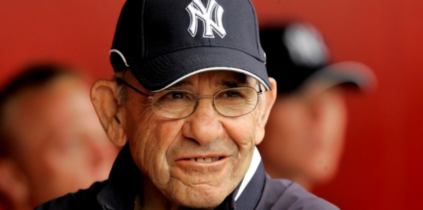 New York Yankees hall of fame catcher Yogi Berra walks in the dugout during a spring training game against the Cincinnati Reds in Sarasota, Fla., Friday, March 14, 2008. (AP Photo/Gene J. Puskar)