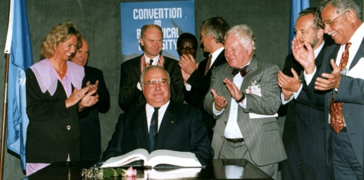 German Chancellor Helmut Kohl acknowledges the applause by a group of unidentified official observers after he has signed the biodiversity treaty at the Earth Summit in Rio de Janeiro. (AP Photo/Ricardo Mazalan/1992)