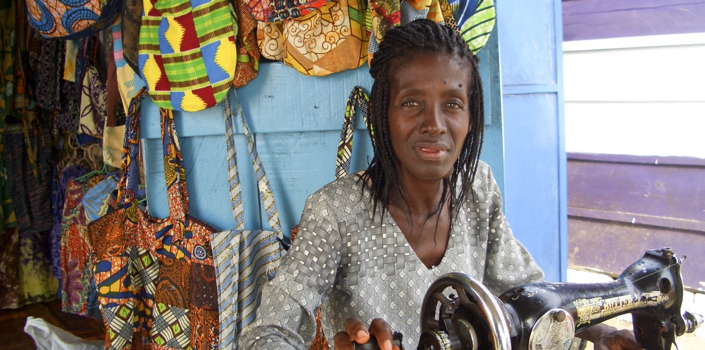 A seamstress works at a sewing machine in her newly opened shop in Cape Coast, Ghana. (Shutterstock)