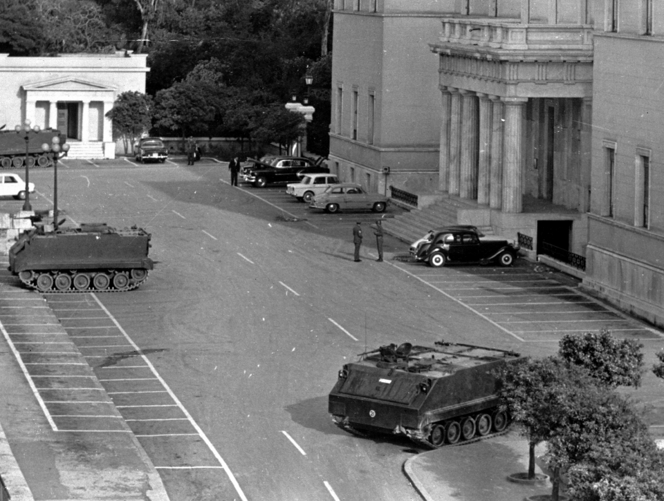 Tanks and troops stand guard outside the Parliament building in Athens, Greece, April 22, 1967, following a coup d'état that installed a military junta. At the time the photo was taken, a curfew was still in effect and troops and tanks remained positioned at communication centres and approaches to the capital. (AP Photo)