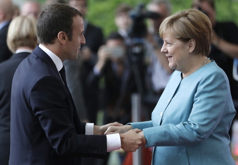 France's President Emmanuel Macron meets Merkel to prepare for G20 summit (AP Photo/Michael Sohn)