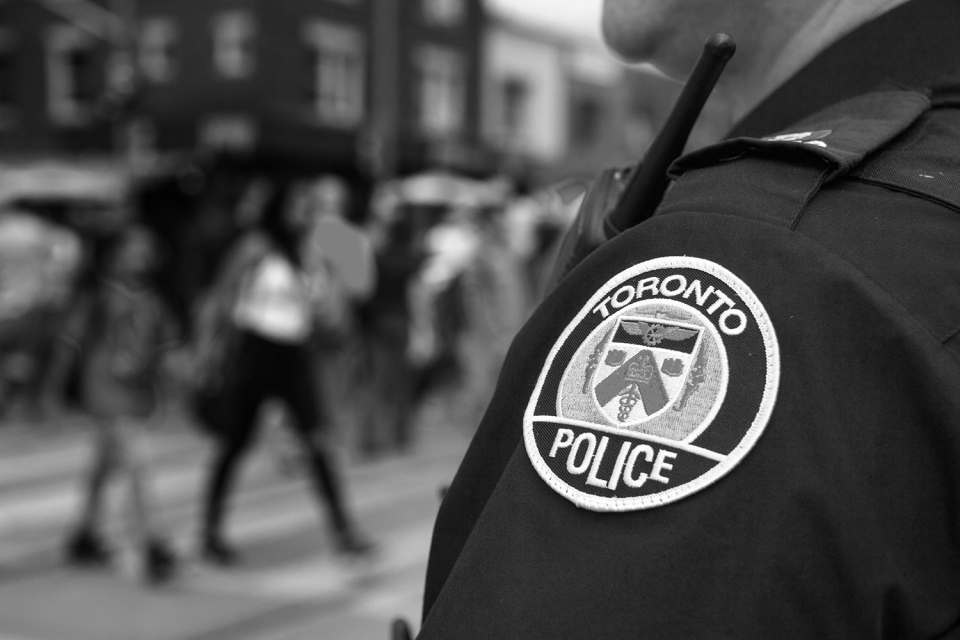 There is concern that biased policing techniques, such as broken windows policing, including stop and frisk, contribute to biased police data. Canada is not immune to problematic policing practice; current enforcement may disproportionately impact poor neighbourhoods and racialized communities. (Photo: Toronto-Images.Com / Shutterstock.com)