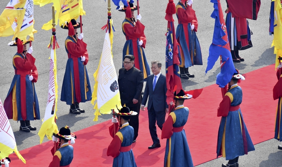 North Korean leader Kim Jong-un and South Korean President Moon Jae-in walk together at the border village of Panmunjom in the Demilitarized Zone on April 27, 2018. (Korea Summit Press Pool via AP)