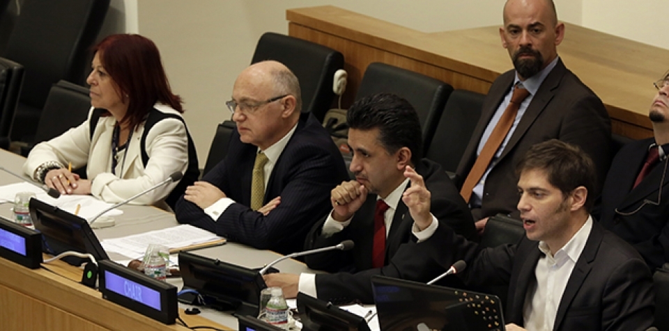 Argentine Economy Minister Axel Kicillof, right, discusses the country's debt payments during a G77 meeting, at United Nations headquarters, Wednesday, June 25, 2014. (AP Photo/Richard Drew)