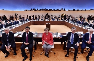 US President Donald Trump, China's President Xi Jinping, German Chancellor Angela Merkel, Argentina's President Mauricio Macri and Australia's Prime Minister Malcolm Turnbull turn around for photographers at the start of the first working session of the 2017 G20 meeting in Hamburg. (John MacDougall/Pool Photo via AP)