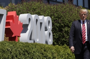 President Donald Trump arrives to participate in the G7 Summit welcome ceremony, on June 8, 2018, in Charlevoix, Canada. (AP Photo/Evan Vucci)