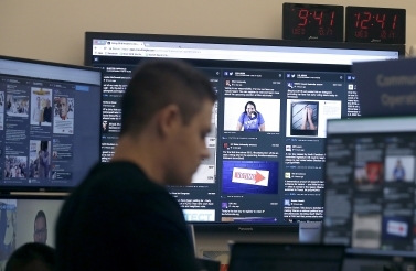 A Facebook staff person monitors election-related content. (AP Photo/Jeff Chiu)
