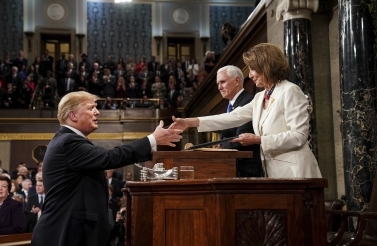 President Donald Trump shakes hands with House Speaker Nancy Pelosi as he arrives in the House chamber before giving his State of the Union address on February 5, 2019. (Doug Mills/The New York Times via AP, Pool)