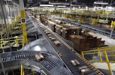 , packages ride on a conveyor system at an Amazon fulfillment center in Baltimore. (AP Photo/Patrick Semansky, File)