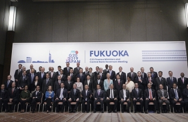 The G20 finance ministers and central bank governors gather for the annual "family photo" during their meeting in Fukuoka, western Japan on June 9, 2019. (AP Photo/Eugene Hoshiko)
