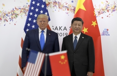 President Donald Trump, left, poses for a photo with Chinese President Xi Jinping during a meeting on the sidelines of the G20 summit in Osaka, Japan on June 29, 2019. (AP Photo/Susan Walsh)