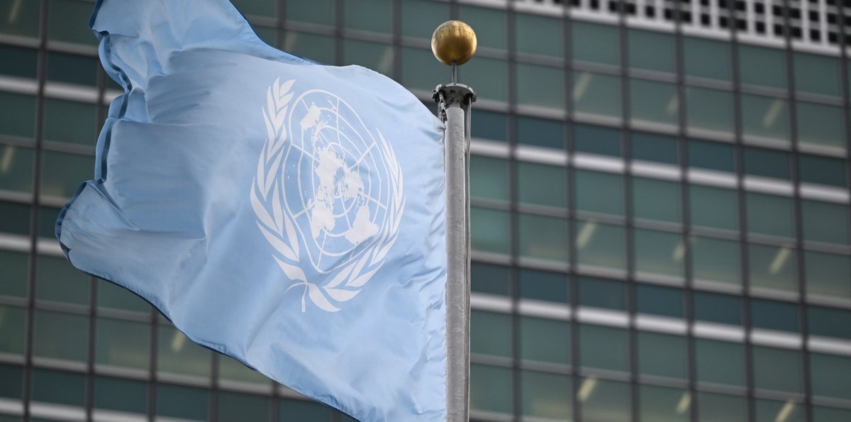 The UN flag flies in front of the Secretariat building at UN headquarters in New York, February 13, 2025. (Anthony Behar/SipaUSA via Reuters Connect)