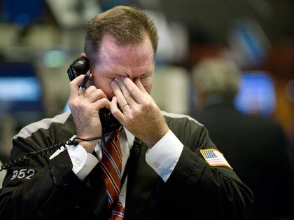 Broker with hand on face (The Associated Press).jpg